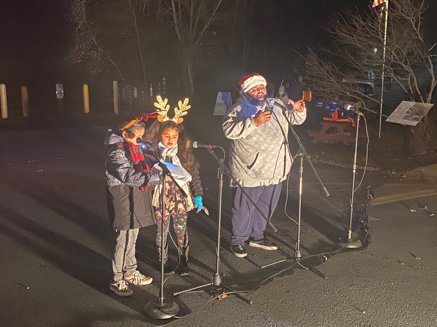 Rev. Charles Perez, pastor of the Barryville United Methodist Church, sings Christmas Carols with his two daughters.